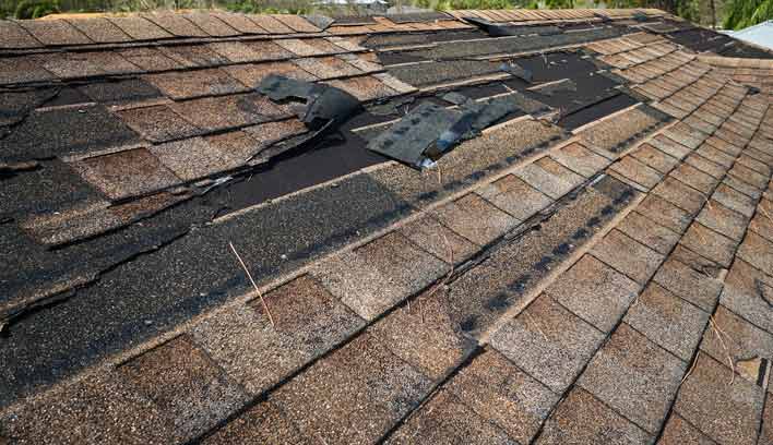 Damaged shingles on home roof